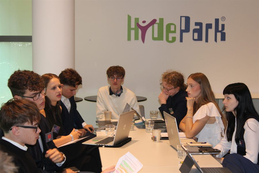 A working group meeting in a breakout space.