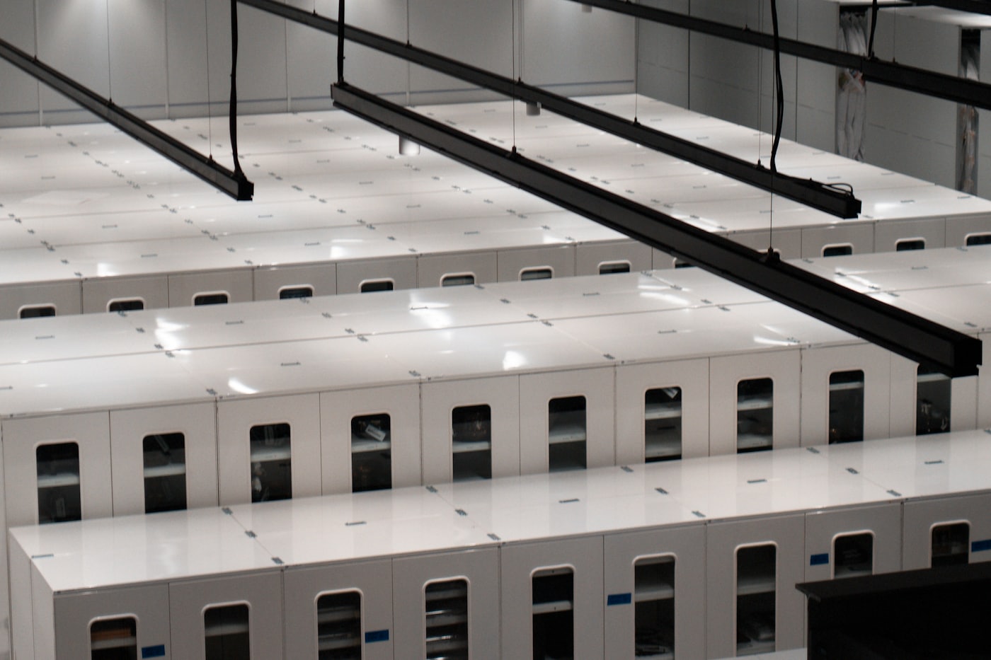 Rows of server cabinets in a modern data centre.