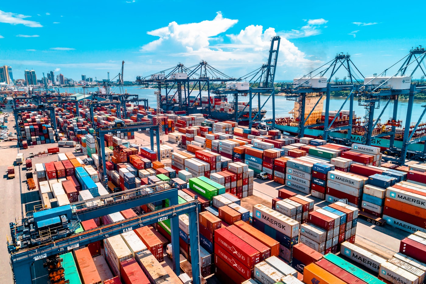 Shipping containers stacked at a freight terminal.