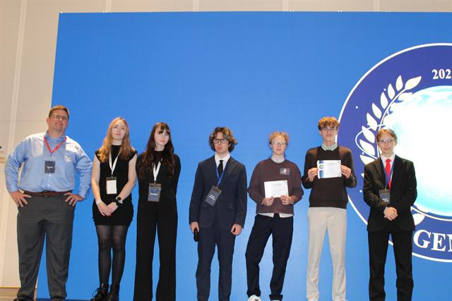 Award winners on stage at the closing ceremony.