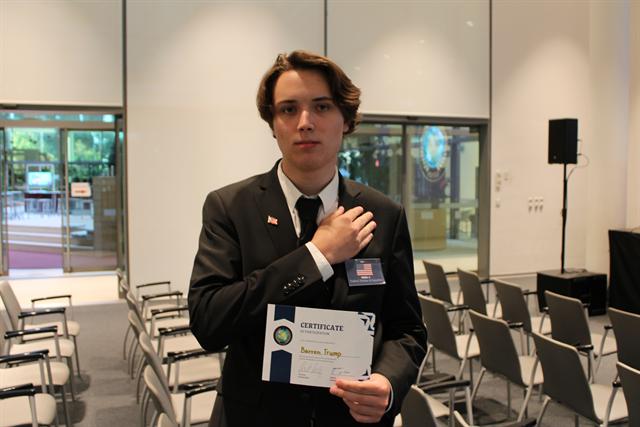 A delegate with their certificate.