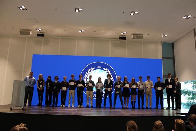 Delegates assembled on stage.