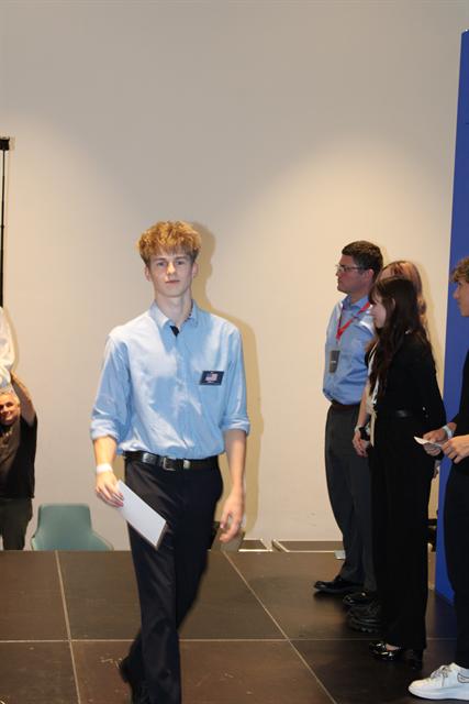 Stepping up to receive a certificate.