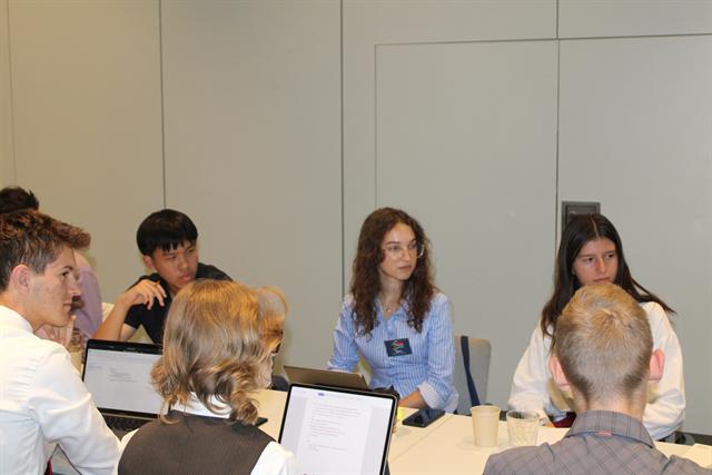 Delegates in discussion between sessions.
